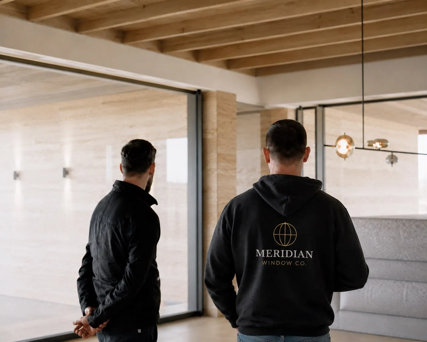 Meridian Window Co. team inspecting windows inside a modern property